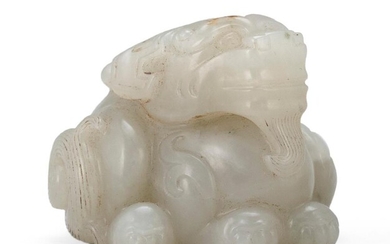 TRANSLUCENT GRAY JADE CARVING OF A TWO-HORNED QILIN...
