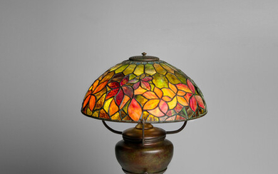 TIFFANY STUDIOS (1899-1930) Woodbine Table Lampcirca 1902-04leaded glass and patinated bronze, shade stamped 'TIFFANY STUDIOS NEW YORK'height 25 1/2in (64.5cm); diameter of shade 16in (39.5cm)