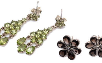 TWO PAIRS OF SILVER GEMSET EARRINGS; 31mm long chandelier drops set with round cut peridots to fringe of pear cut peridots, others 1...