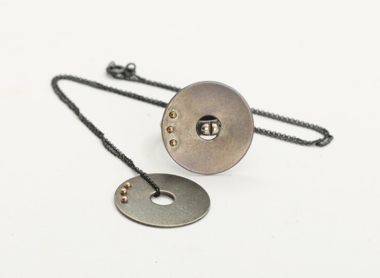 NOT SOLD. Toftegaard: A 14k gold and oxidized sterling silver "Mono" ring and pendant. Oxidized...