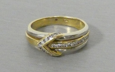 Two gold ring paved with diamonds forming an...