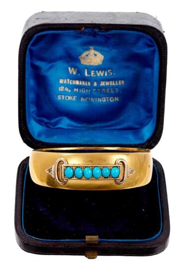 Victorian gold hinged bangle with a line of six turquoise cabochons and two small diamonds to the buckle terminals, in fitted box