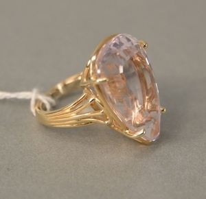 14 karat gold ring, set with pear shaped topaz, light