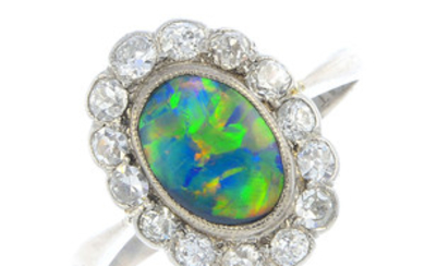 An early 20th century opal and diamond cluster ring. View more details