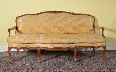 A Louis XV carved beech and upholstered sofa
