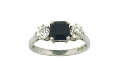 A sapphire and diamond three-stone ring The central...