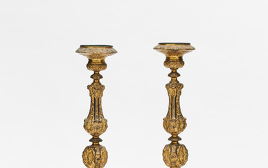 A PAIR OF CONTINENTAL GILT METAL BAROQUE STYLE PRICKET CANDLESTICKS