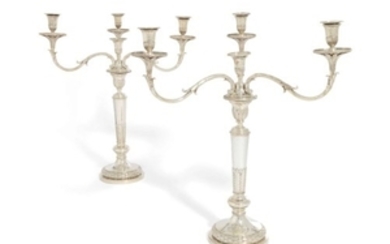 A PAIR OF GEORGE III SILVER FOUR-LIGHT CANDELABRA, THE BASES, SUPPORTS FOR BRANCHES, TWO SOCKETS AND WAX-PANS WITH MARK OF WILLIAM ELLIOTT, LONDON, 1819, THE BRANCHES, SIX SOCKETS, NOZZLES AND WAX-PANS WITH MARK OF JOHN SCOFIELD, OR MAKER'S MARK...