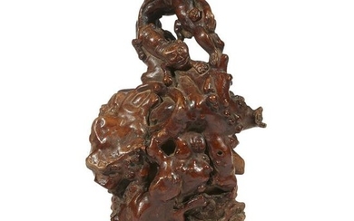 A Chinese rootwood vase carved with figures and