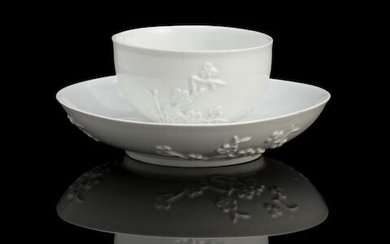 A Meissen blanc de chine cup and saucer