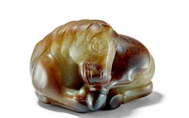 A CELADON AND RUSSET JADE HORSE