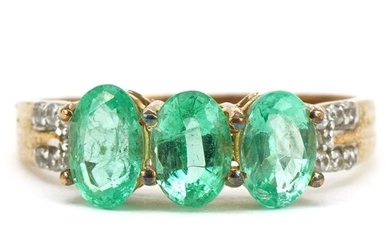 9ct gold emerald three stone ring with white spinel set shou...