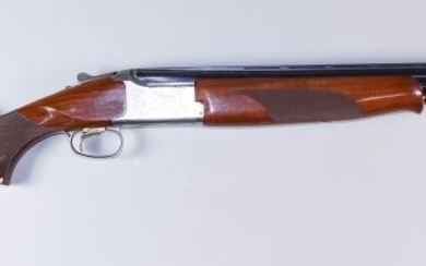 A 12 Bore Over and Under Shotgun, by Browning,...