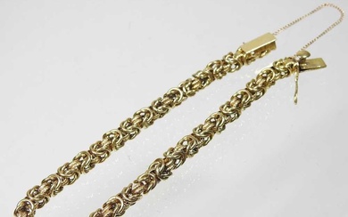 A 14 carat gold fancy link bracelet, the clasp with...