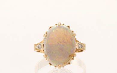 A 14K red and white gold ring with an oval-cut opal and round brilliant-cut diamonds