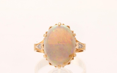 A 14K red and white gold ring with an oval-cut opal and round brilliant-cut diamonds