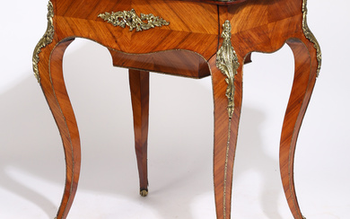 A 19TH CENTURY FRENCH KINGWOOD AND ORMOLU TABLE.