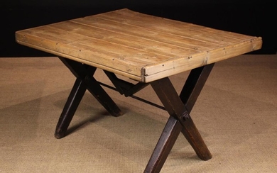 A 19th Century Tavern Table. The pine planked rectangular top with applied edging rails, standing on