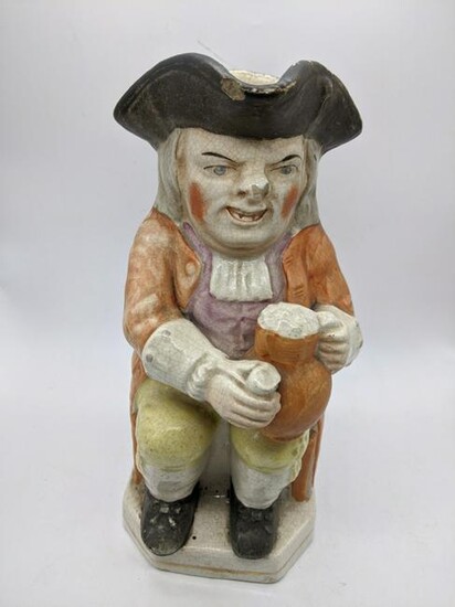 A 19th century Staffordshire pottery toby jug, H.24cm
