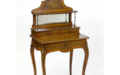 A 19thC mahogany Bonheur du jour with a shaped and mirrored ...