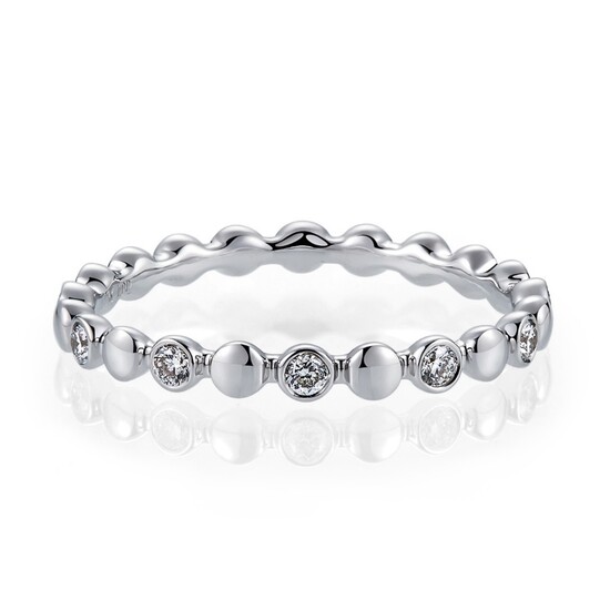 A 9ct white gold (stamped 375) diamond set full eternity ring, (N).