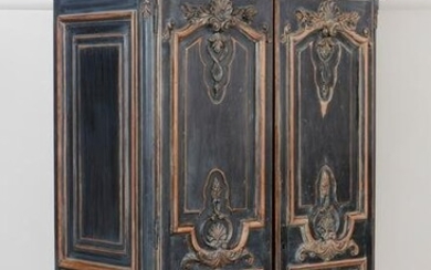 A Baroque style black painted armoire