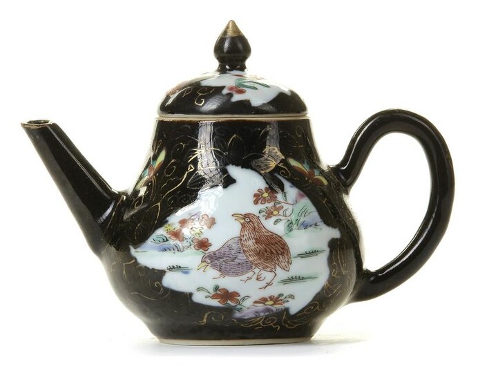 A CHINESE DARK-GROUND FAMILLE ROSE TEAPOT AND COVER