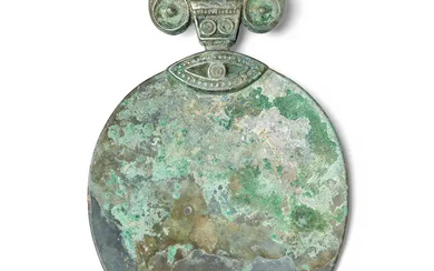 A Chinese archaic silvered bronze hand mirror Han dynasty With stylised ram...