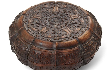A Chinese carved suanzhi wood treasure box and cover, 18th/19th century, of decagonal lobed form atop a short foot, the cover carved with a flower encircled by birds and archaistic motifs, the sides carved with further archaistic motifs, with two...