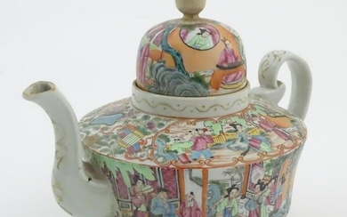 A Chinese famille rose teapot decorated with figures