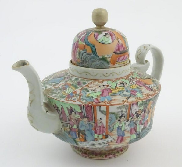 A Chinese famille rose teapot decorated with figures
