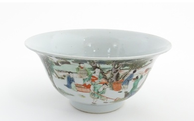 A Chinese famille verte bowl decorated with figures harvesti...