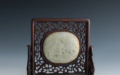 A Chinese hardwood table screen with carved white jade 'lion' plaque, 18th/19th century