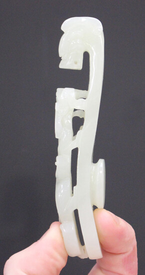 A Chinese pale celadon jade belt hook, late Qing dynasty or possibly later, of typical serpentine fo