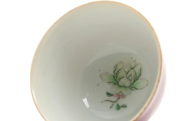 A Chinese porcelain cup, the outside decorated in monochrome pink glaze, inside...