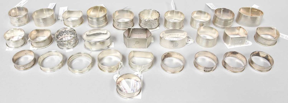A Collection of Assorted Silver Napkin-Rings, variously decorated and shaped,...