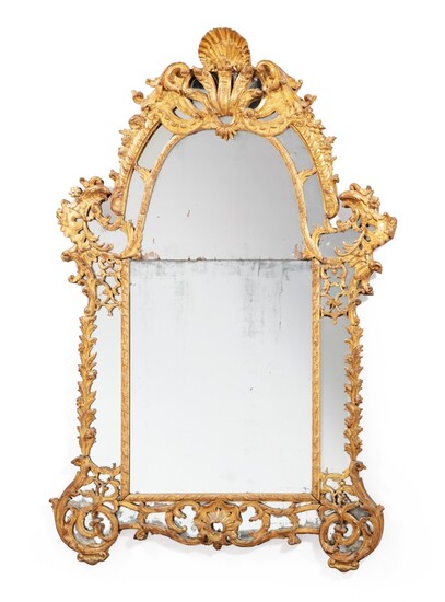 A French Régence gilt wood mirror, circa 1720 | Miroir à parecloses en bois sculpté et doré d'époque Régence , vers 1720