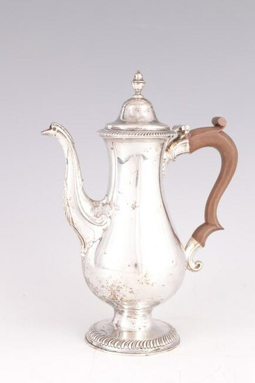 A GEORGE III NEWCASTLE SILVER COFFEE POT of baluster