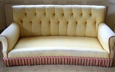 A GOOD QUALITY YELLOW GROUND UPHOLSTERED THREE SEATER