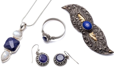 A GROUP OF SILVER, LAPIS AND STONE SET JEWELLERY; wing motif brooch centring a cabochon lapis and gold plated highlights, length 77m...
