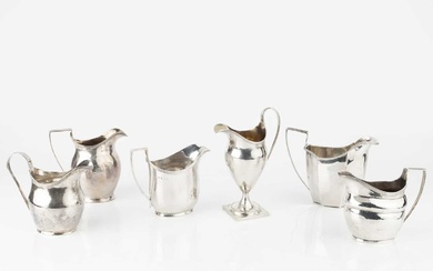 A George III silver cream jug, on square pedestal foot...