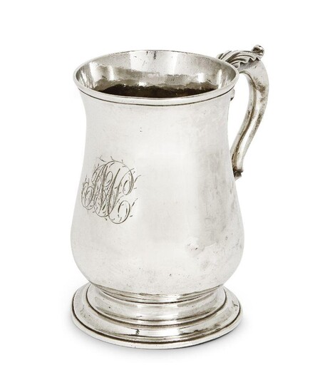 A George III silver mug, London, 1767, John King, of baluster form, the scroll handle with foliate thumbpiece, 13cm high, approx. weight 12.1oz