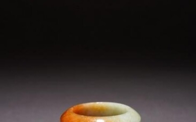 A HARDSTONE CARVED ARCHER'S RING