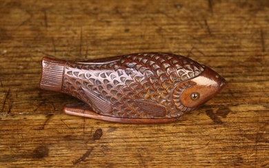 A Late 19th Century Treen Snuff Box in the form of a fish with chip carved scales, glass inset eyes