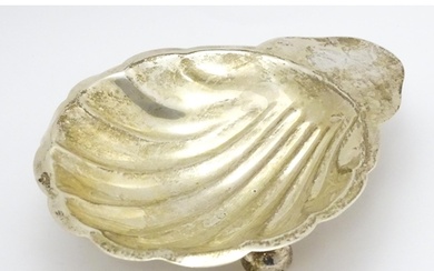 A Mexican sterling silver butter dish of scallop shell form ...