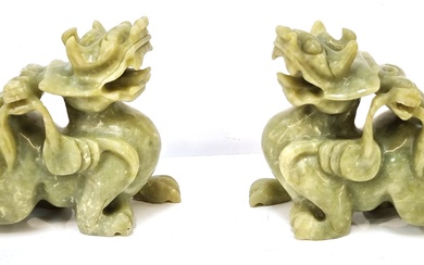 A PAIR OF CHINESE CARVED GREEN STONE KYLIN AND BAT FIGURES