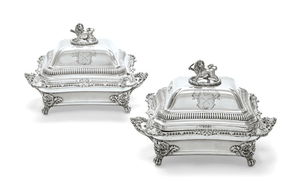 A PAIR OF EARLY VICTORIAN SILVER ENTRÉE DISHES AND COVERS AND SHEFFIELD-PLATED WARMING STANDS, THE DISHES AND COVERS MARK OF BARNARD BROTHERS, LONDON, 1840; THE WARMING STANDS MARK OF MATTHEW BOULTON, BIRMINGHAM, CIRCA 1840