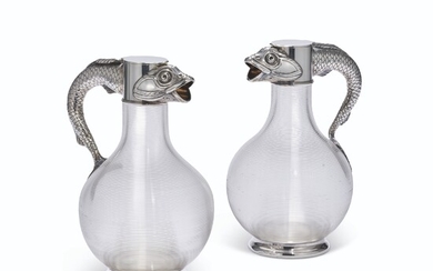 A PAIR OF PARCEL-GILT SILVER-MOUNTED CUT-GLASS CLARET JUGS