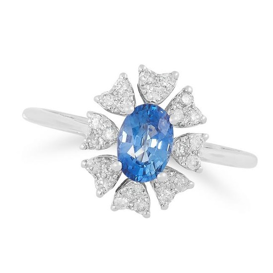A SAPPHIRE AND DIAMOND CLUSTER RING set with an oval