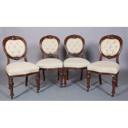 A SET OF FOUR VICTORIAN MAHOGANY DINING CHAIRS each having a...